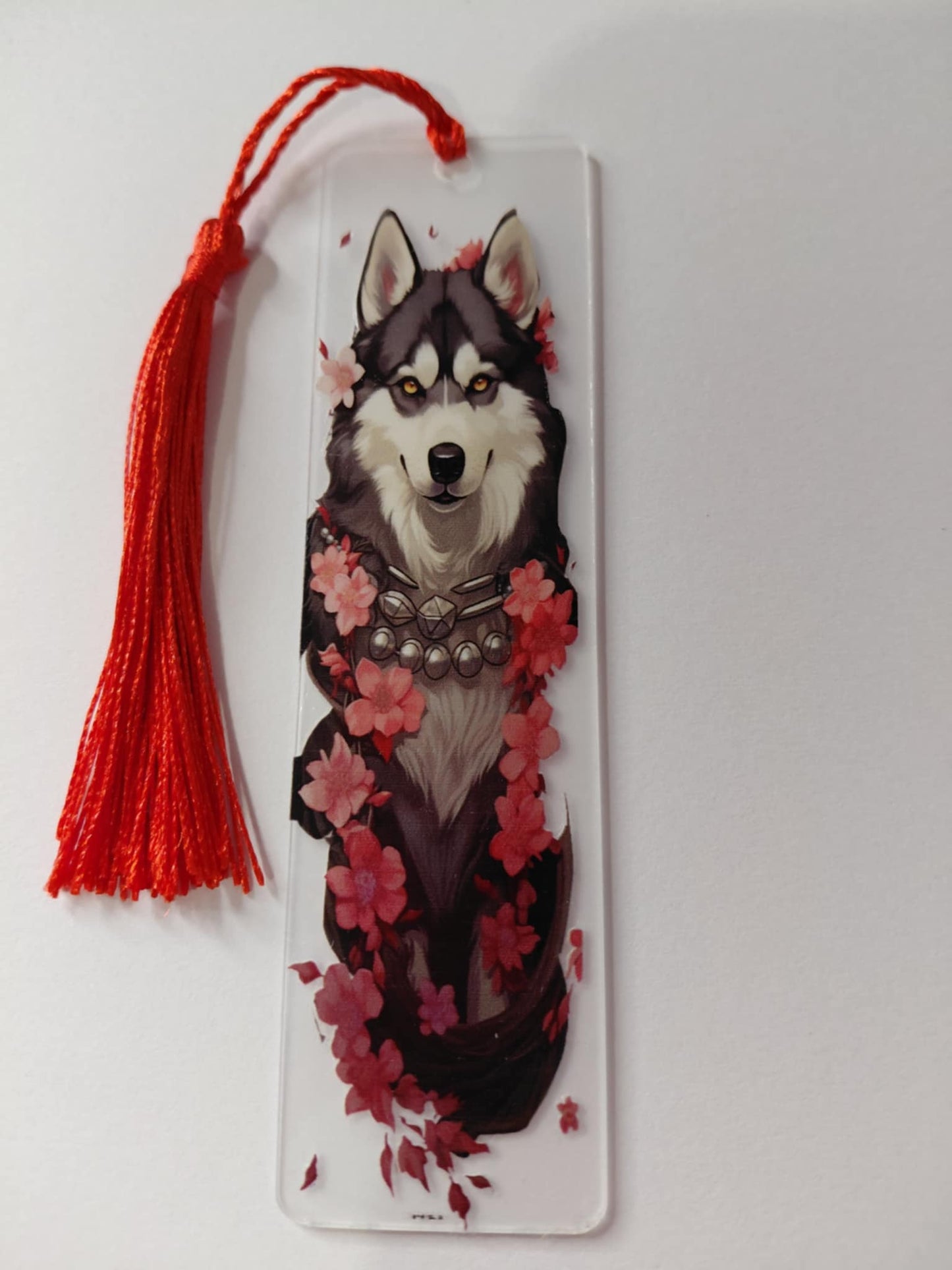 Marque pages avec une image de chien pompon rouge
