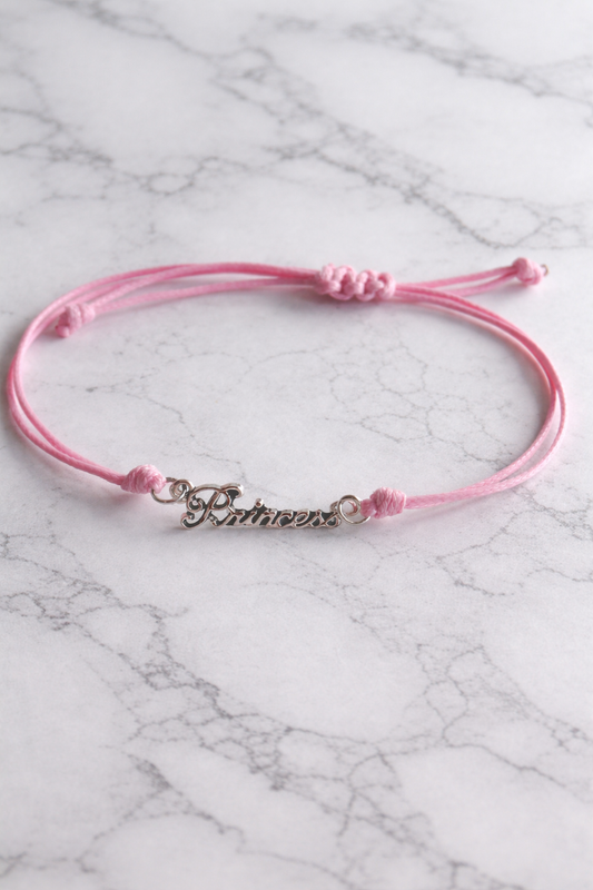 Bracelet réglable en cordon rose . Convient à la plupart des poignets.