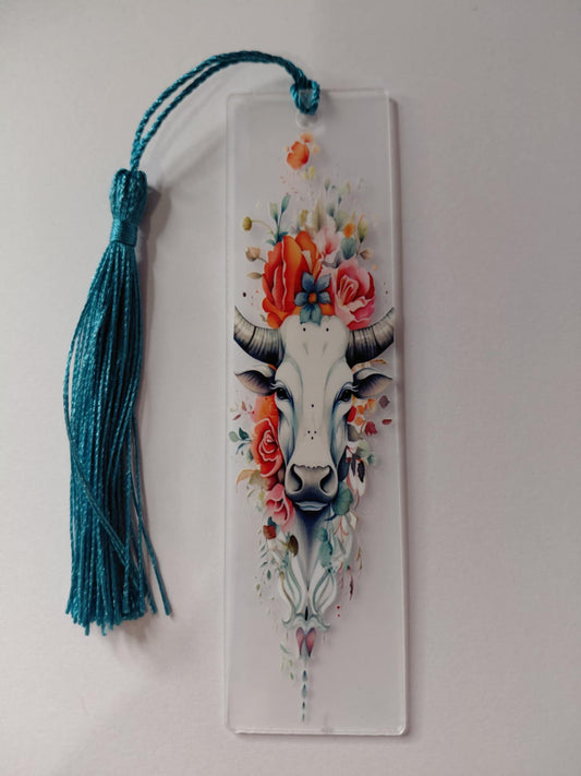 Marque pages avec une image des vache avec des fleure pompon bleu
