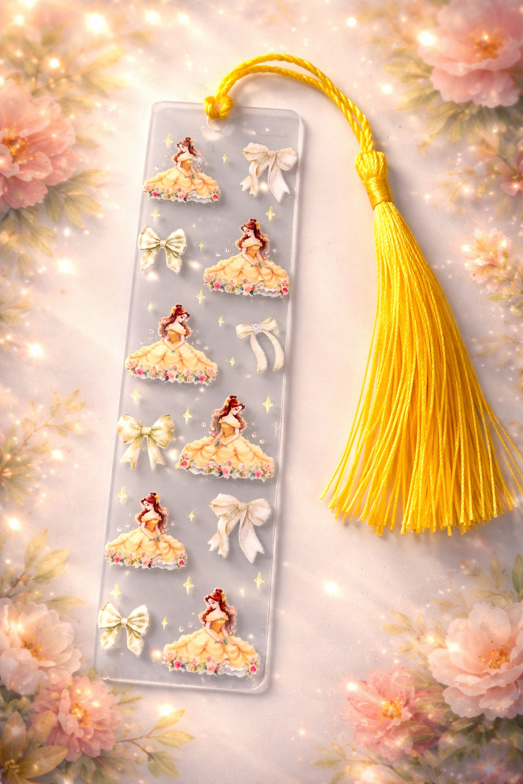 marque pages avec les pompon jaune est  belle avec sa belle robe 