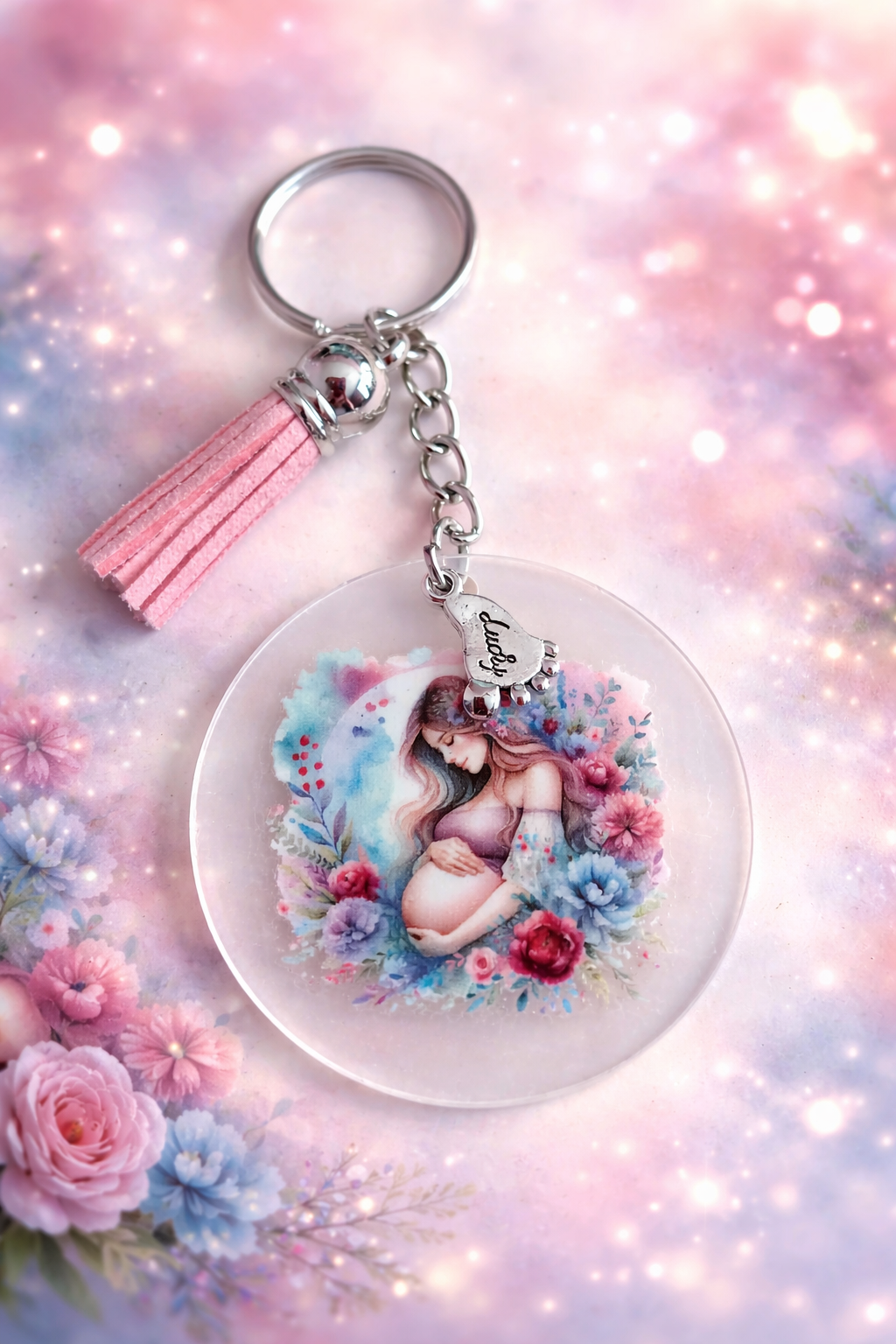 jolie porte clés avec pompon rose  et un pied en métal  