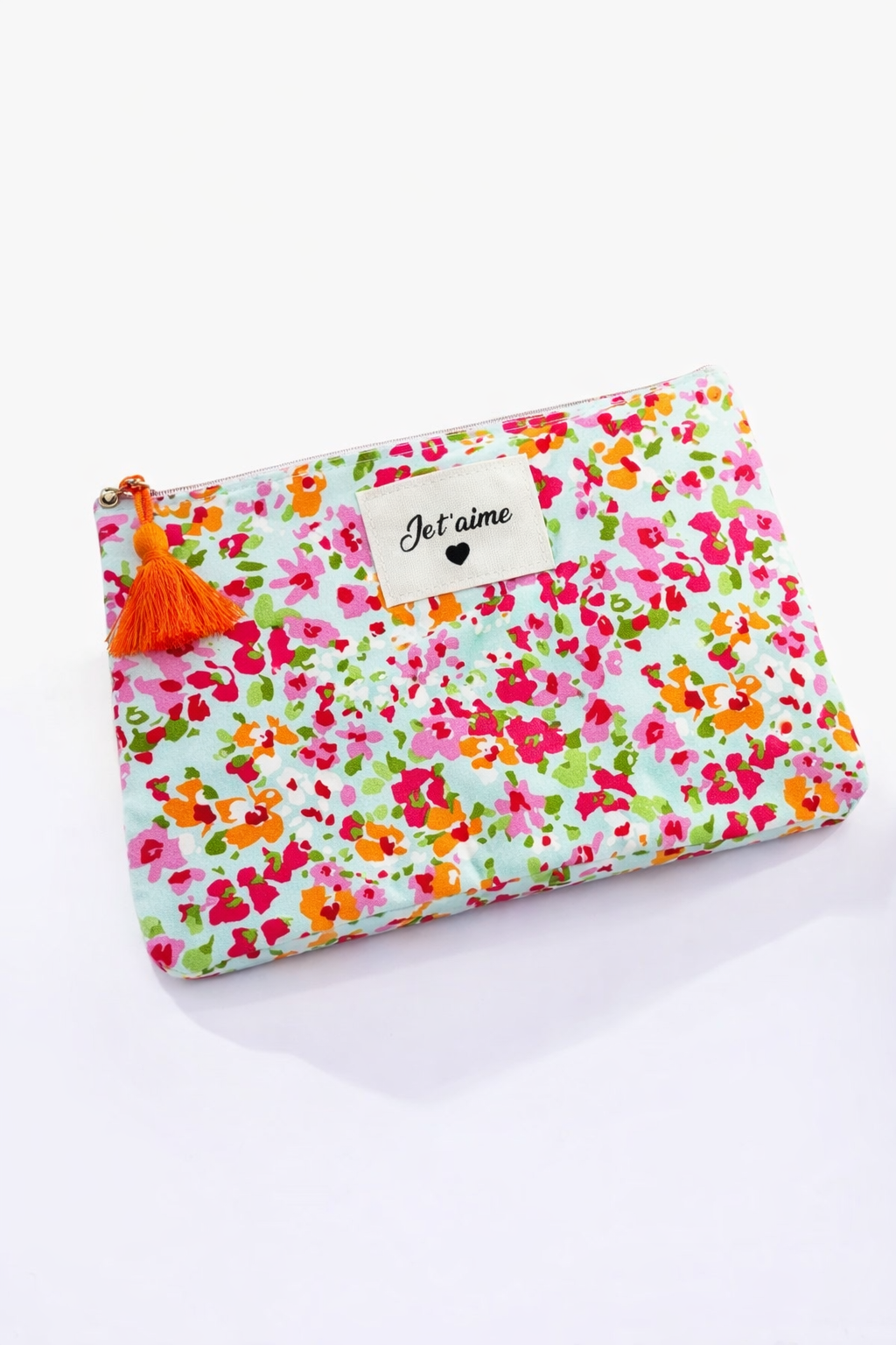 Trousse à maquillage avec un pompon orange et une inscription Je t'aime 