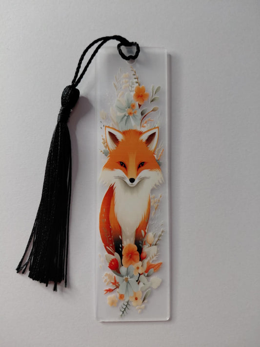 marque pages avec une image d un renard avec des fleur et un pompon noir 